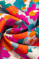 Mini-robe florale à col noué et manches bouffantes