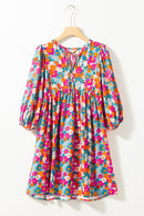Mini-robe florale à col noué et manches bouffantes