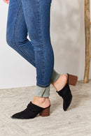Mules con ribete trenzado y puntera en punta de East Lion Corp