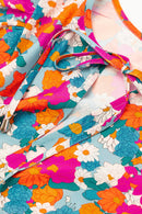 Mini-robe florale à col noué et manches bouffantes