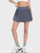 Jupe active à taille mi-haute et détails plissés