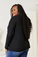 Haut à manches longues et col rond avec coutures doubles