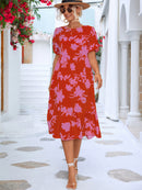 Robe midi fleurie à manches bouffantes et ourlet à volants